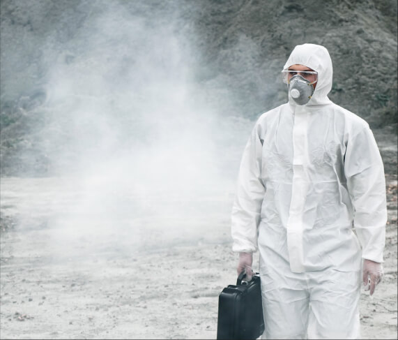 worker walking away from dust