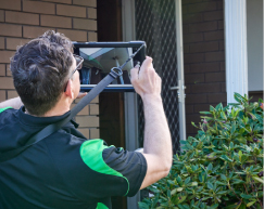 greenlight asbestos inspector taking images of outside house